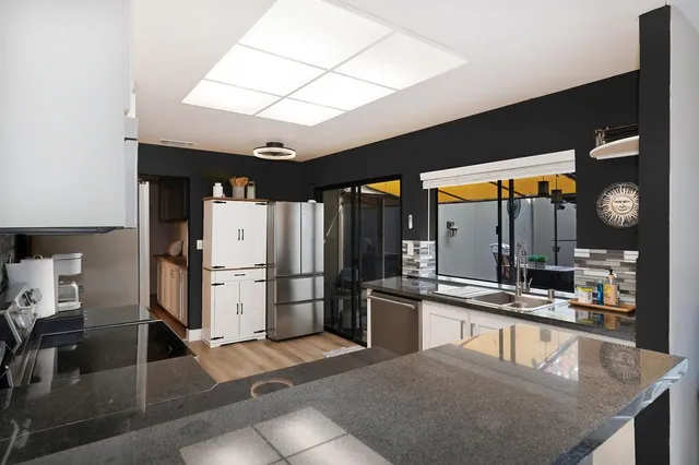 a bathroom with a sink double vanity and a mirror