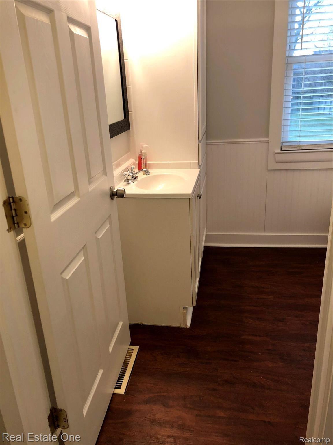 235 Millville Road Lapeer, MI 48446 - Photo 20 of 48 First floor bathroom with vinyl floors and shower
