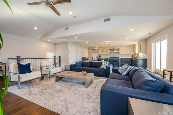 a living room with furniture and a rug