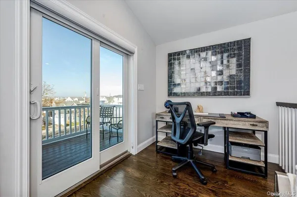 a workspace with furniture and a gate