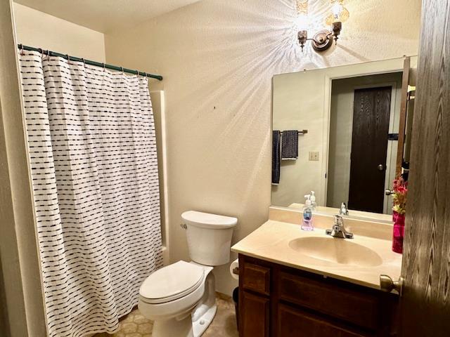 18288 Mountaintop Lane Grass Valley, CA 95949 - Photo 15 of 40 a bathroom with a sink a toilet and mirror