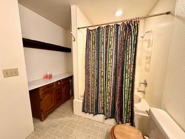 18288 Mountaintop Lane Grass Valley, CA 95949 - Photo 24 of 40 a bathroom with a sink a toilet and shower curtain