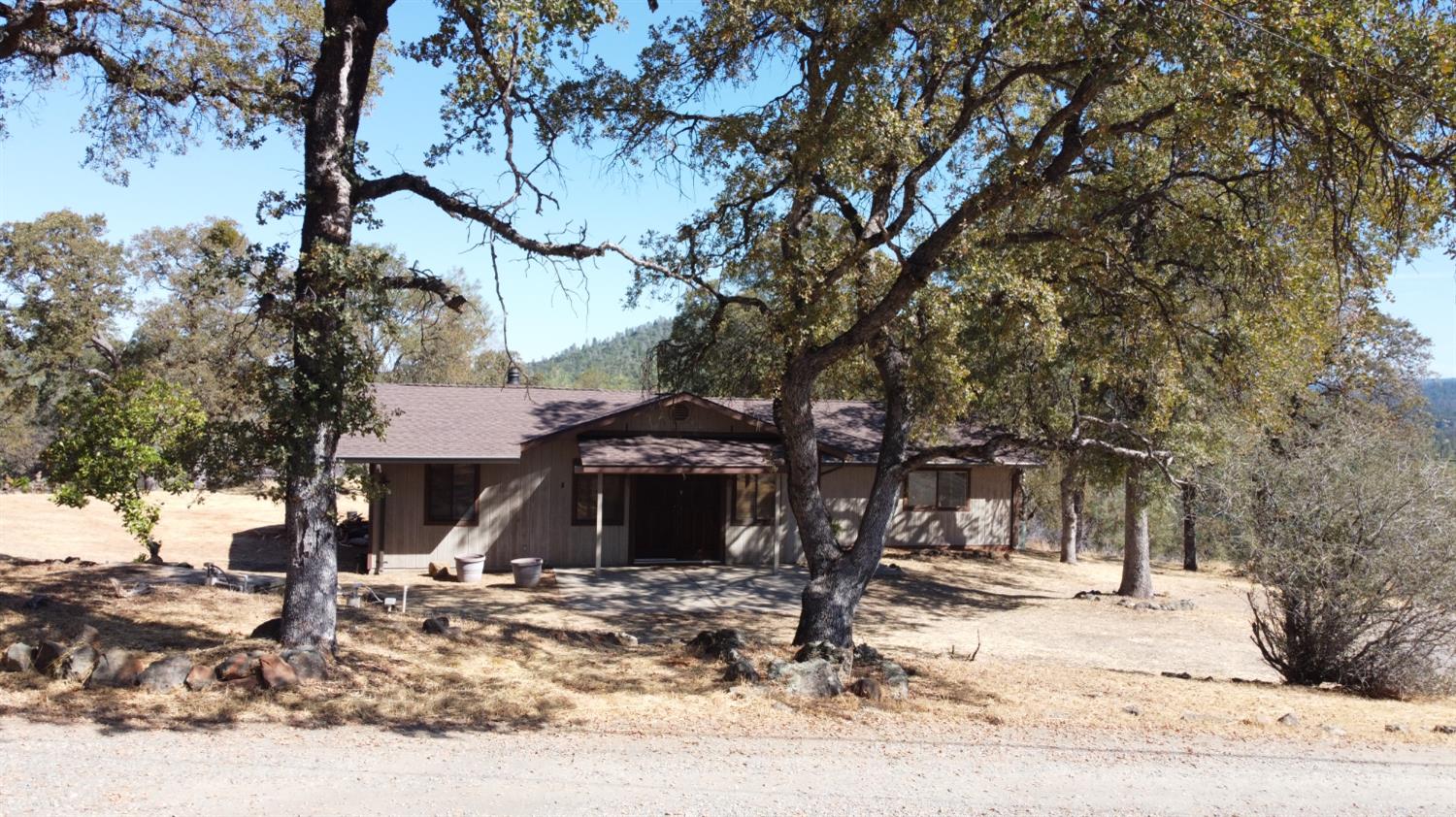 18288 Mountaintop Lane Grass Valley, CA 95949 - Photo 30 of 40 a view of a house with snow on the background