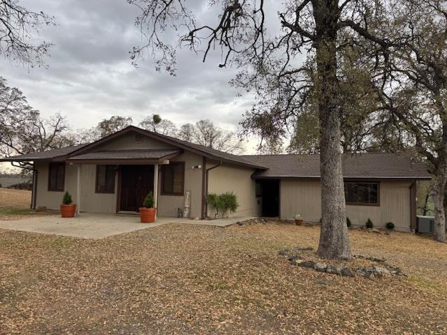 18288 Mountaintop Lane Grass Valley, CA 95949 - Photo 32 of 40 a front view of a house with a yard and garage