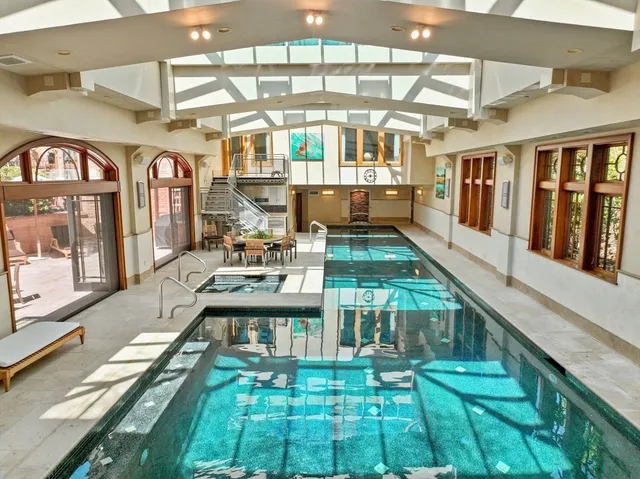 a view of swimming pool with outdoor seating