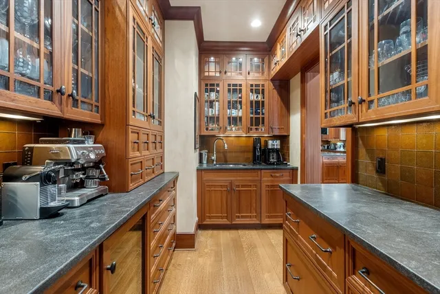 a kitchen with stainless steel appliances granite countertop a sink stove and cabinets