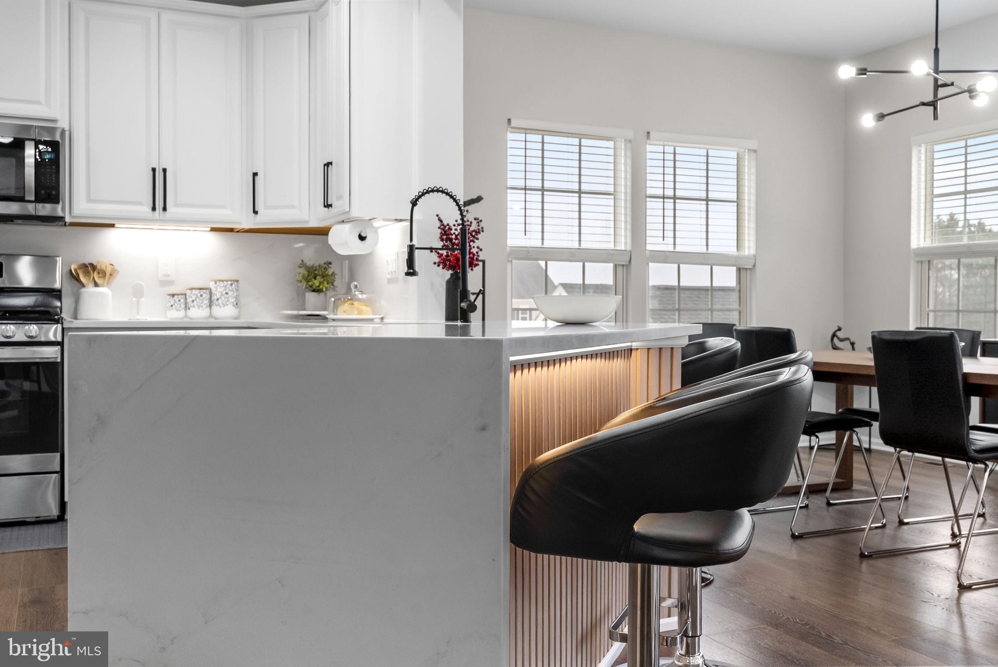 638 Bridge Street Spring City, PA 19475 - Photo 19 of 59 a kitchen with stainless steel appliances a table and chairs in it