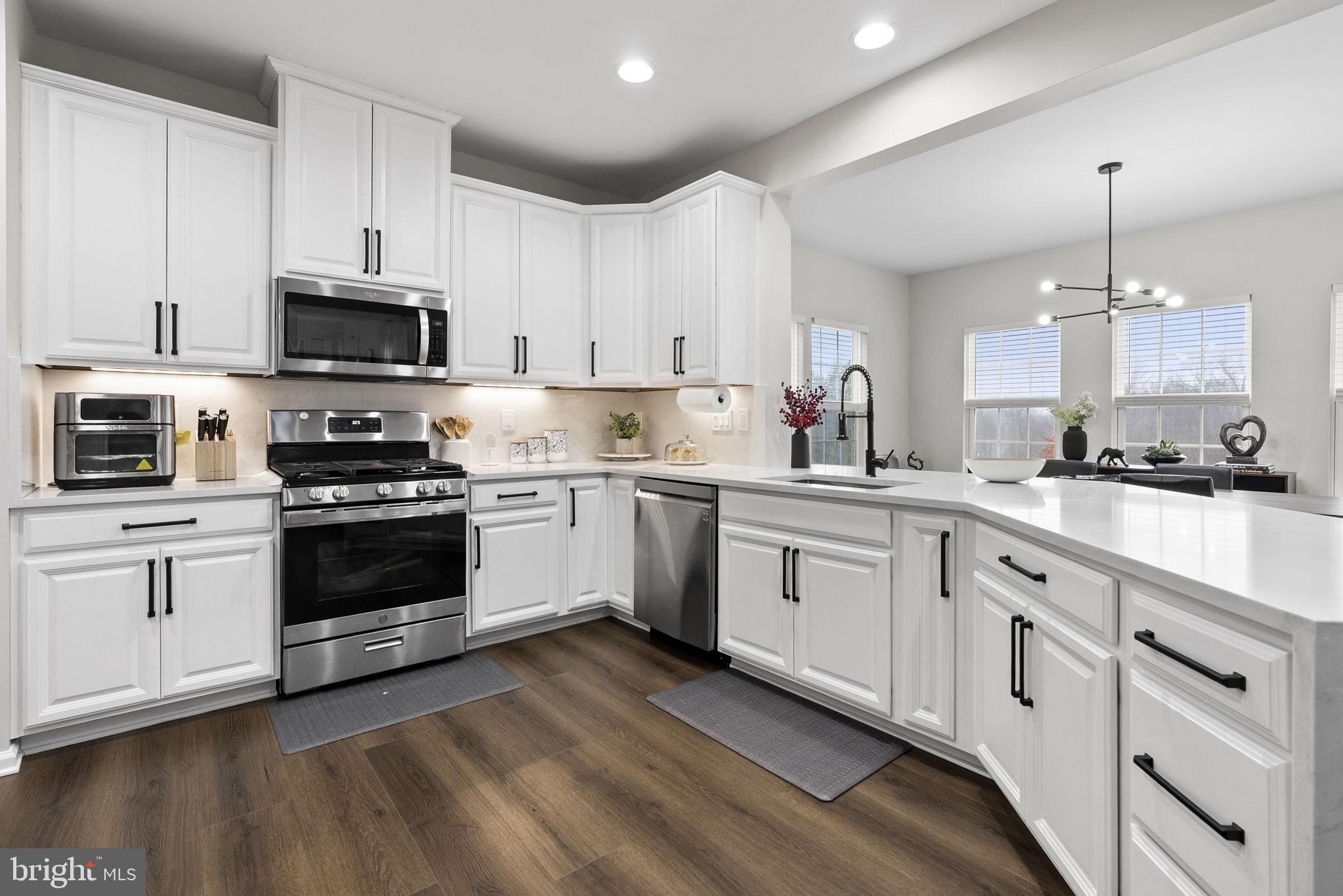 638 Bridge Street Spring City, PA 19475 - Photo 28 of 59 a kitchen with granite countertop white cabinets and stainless steel appliances