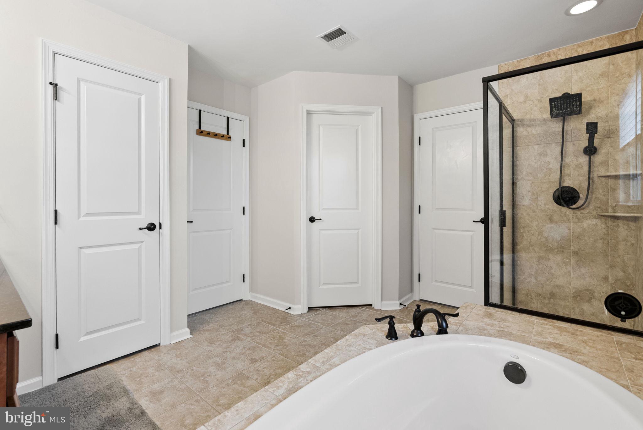 638 Bridge Street Spring City, PA 19475 - Photo 32 of 59 a bathroom with a tub sink and mirror