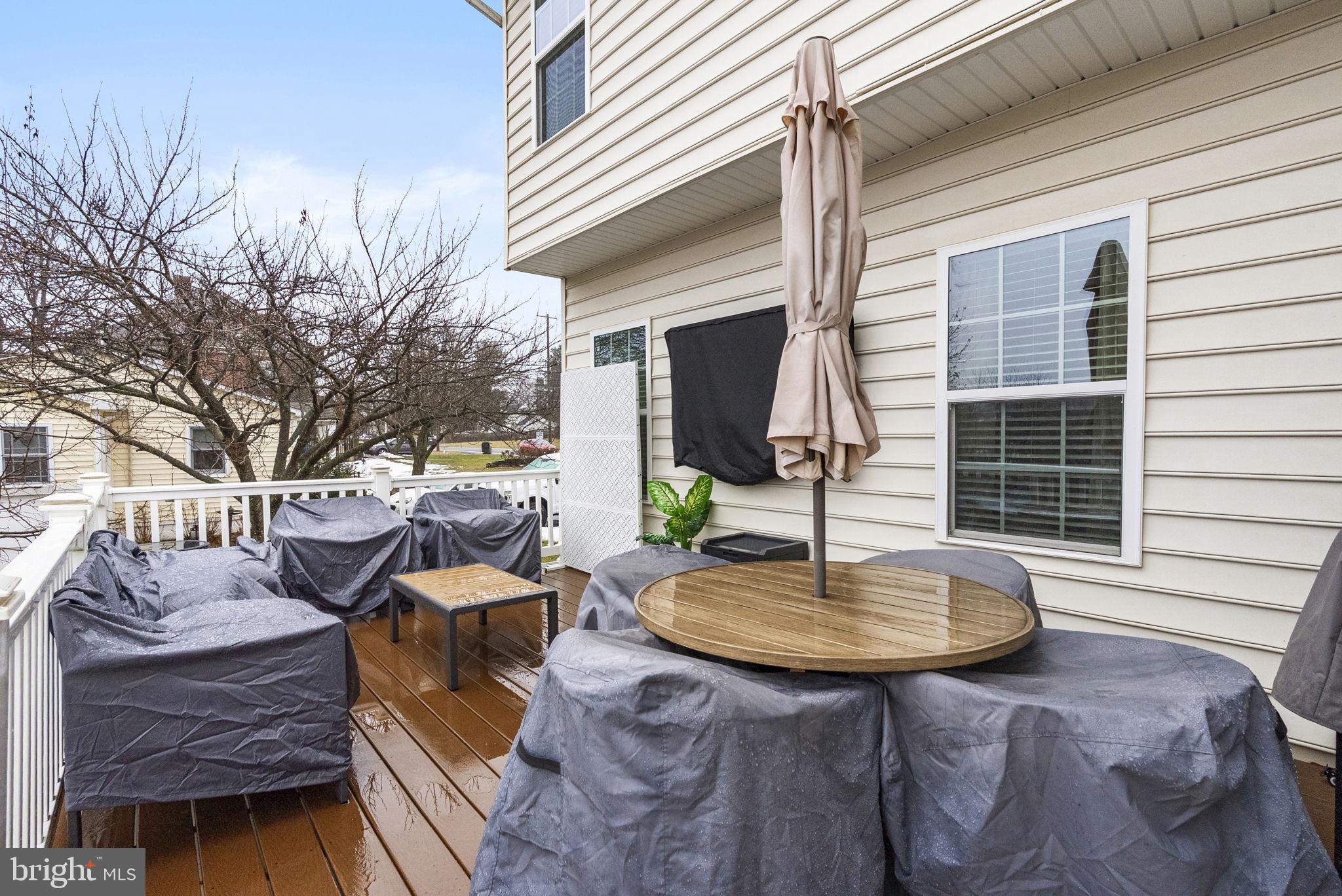 638 Bridge Street Spring City, PA 19475 - Photo 47 of 59 a view of a patio with a table chairs and a potted plant