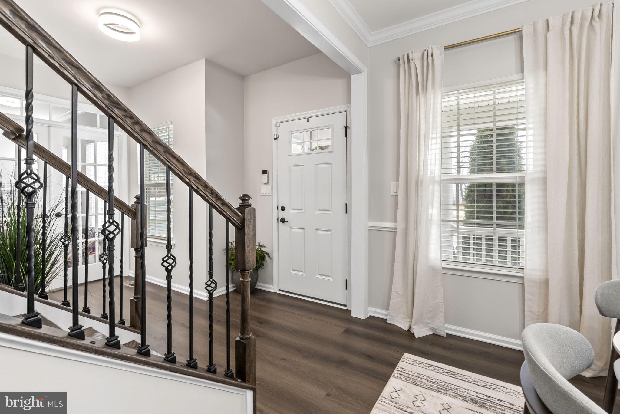638 Bridge Street Spring City, PA 19475 - Photo 6 of 59 a view of an entryway with wooden floor and windows