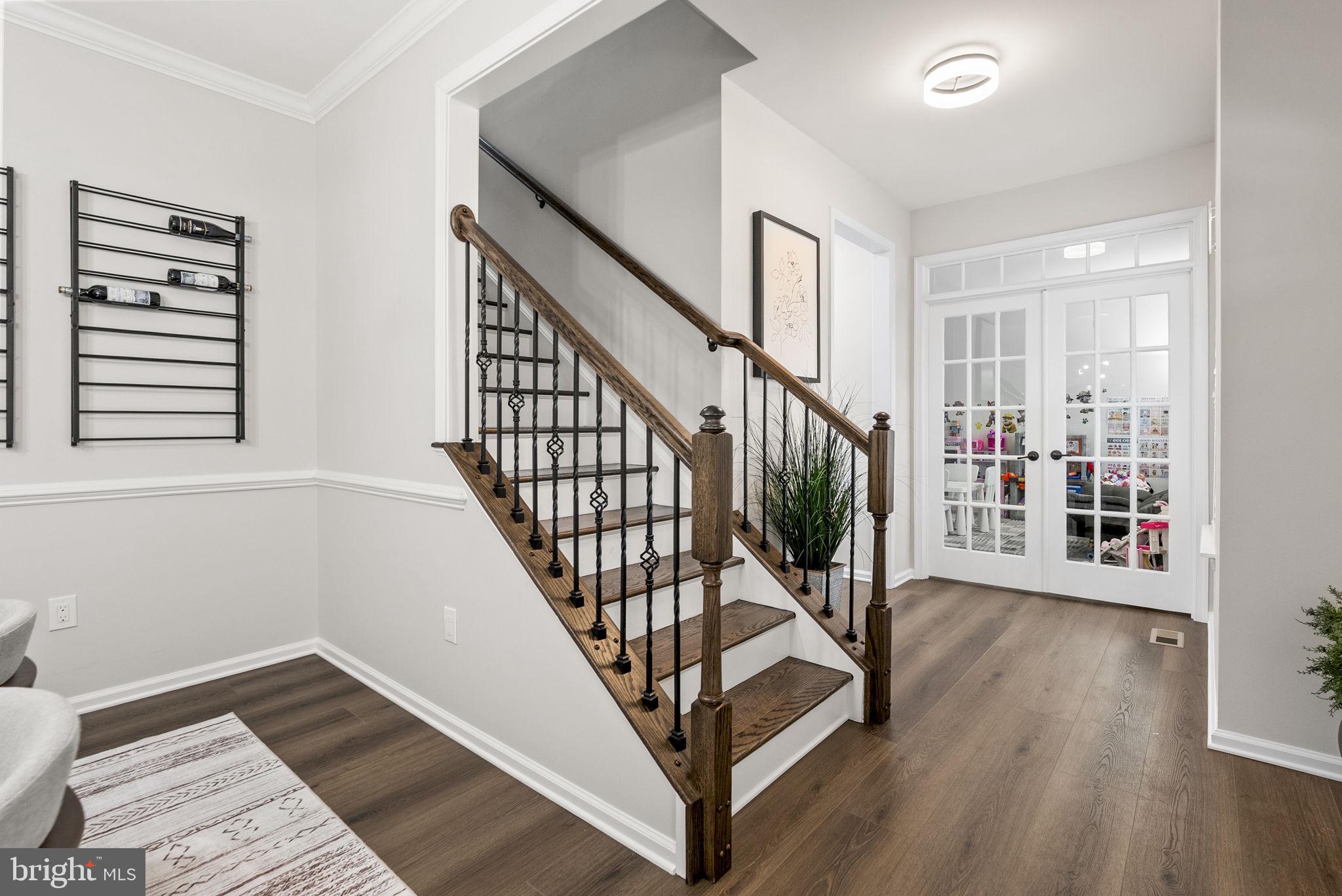 638 Bridge Street Spring City, PA 19475 - Photo 7 of 59 a view of entryway with wooden floor and stairs