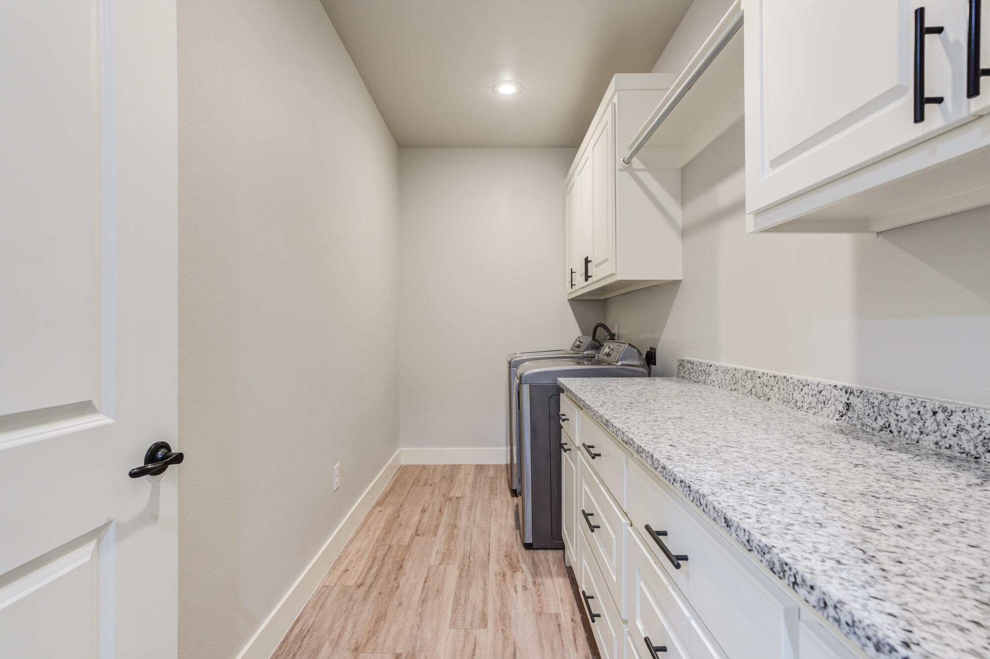 5611 117th Street Lubbock, TX 79424 - Photo 19 of 30 a view of a kitchen counter space and wooden floor