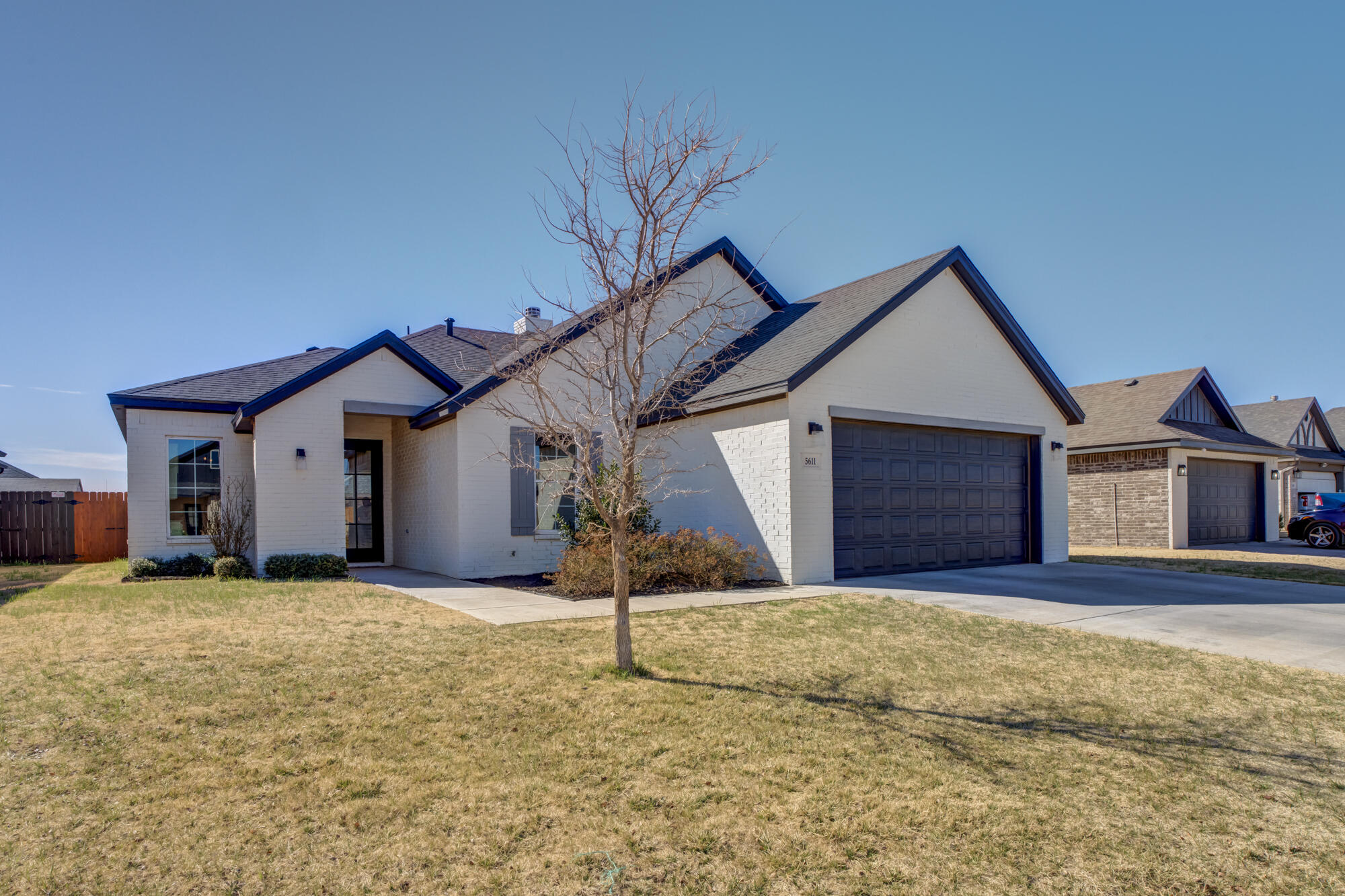 5611 117th Street Lubbock, TX 79424 - Photo 2 of 30 a house with trees in the background