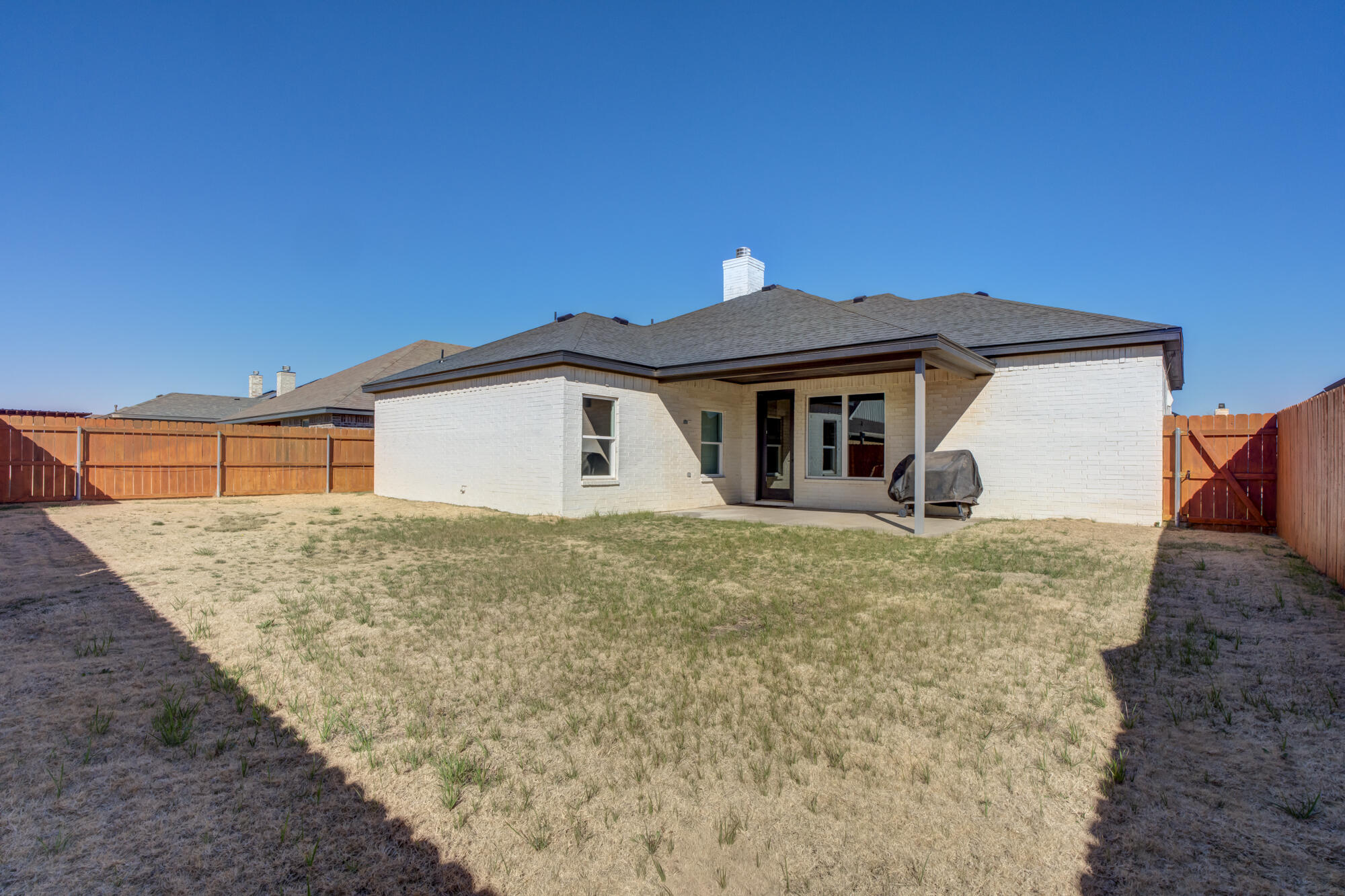 5611 117th Street Lubbock, TX 79424 - Photo 29 of 30 a front view of a house with a yard