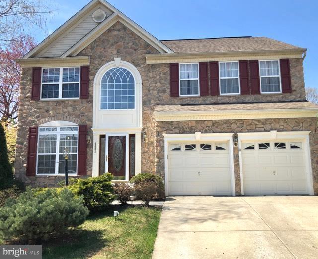 6602 Aaron Mee Way Baltimore, MD 21237 - Photo 1 of 30 a front view of a house with a yard garage and outdoor seating