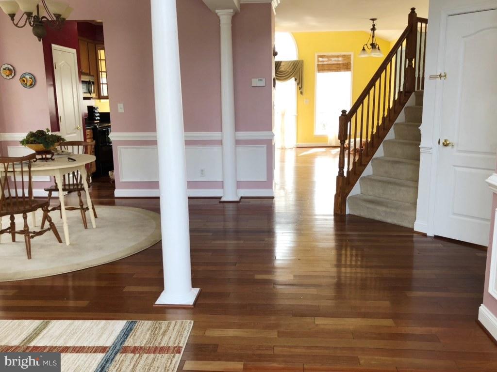 6602 Aaron Mee Way Baltimore, MD 21237 - Photo 3 of 30 a view of entryway and hall with wooden floor