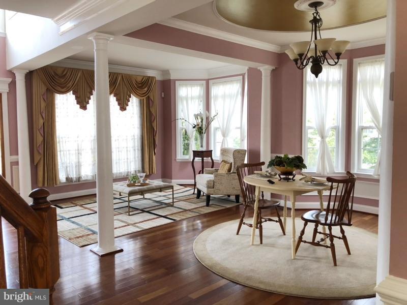 6602 Aaron Mee Way Baltimore, MD 21237 - Photo 5 of 30 a view of a dining room with furniture window and wooden floor