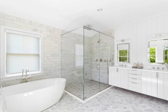 a bathroom with a bathtub sink and toilet