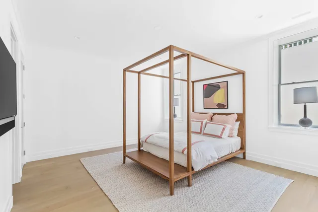 a bed room with a bed and a window