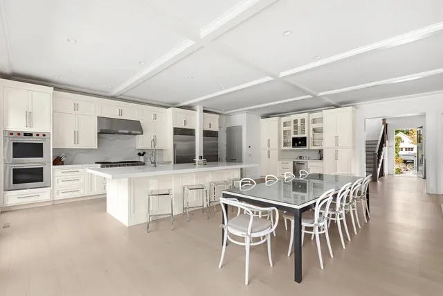 a dining room with furniture and wooden floor