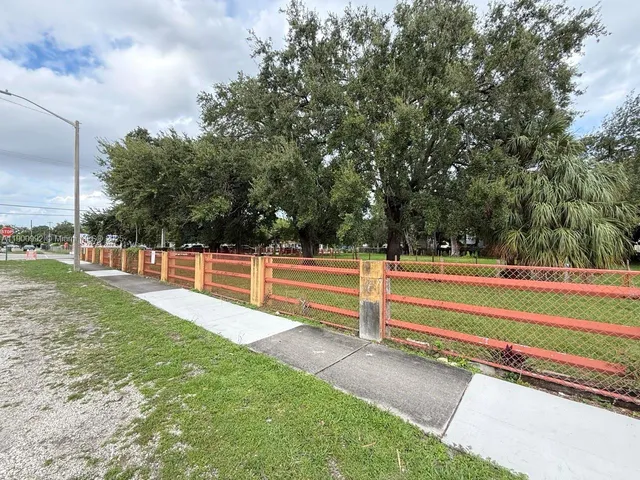 a view of backyard with large trees