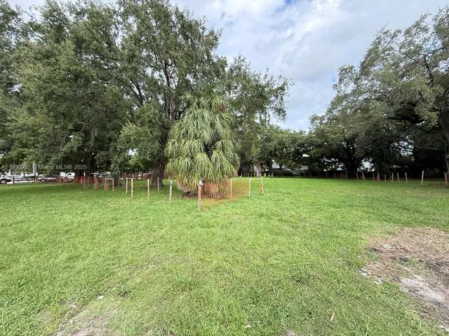 a view of outdoor space with deck and yard