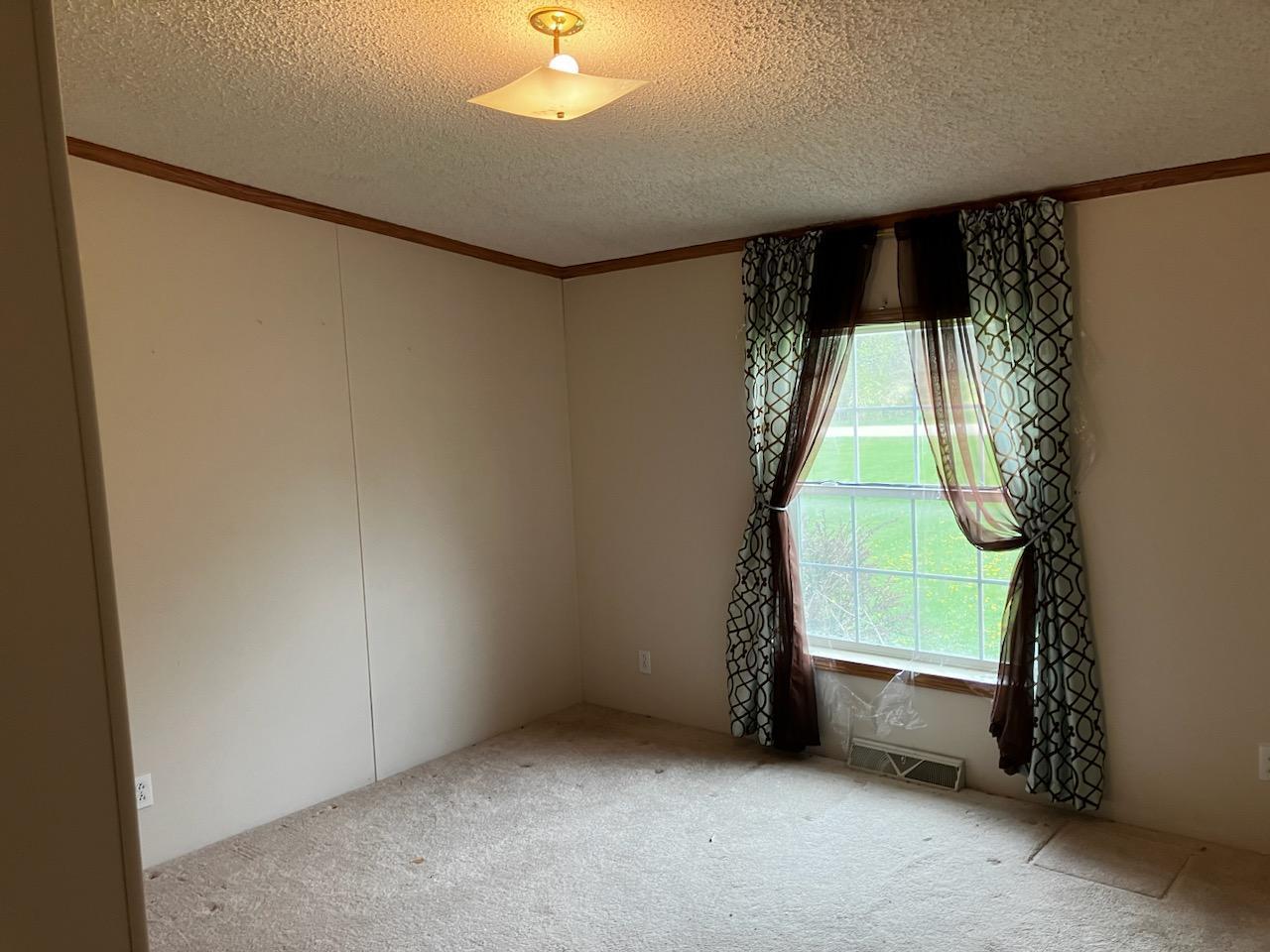 7300 South Rock Nation Road Dixon, IL 61021 - Photo 11 of 24 an empty room with windows and entryway