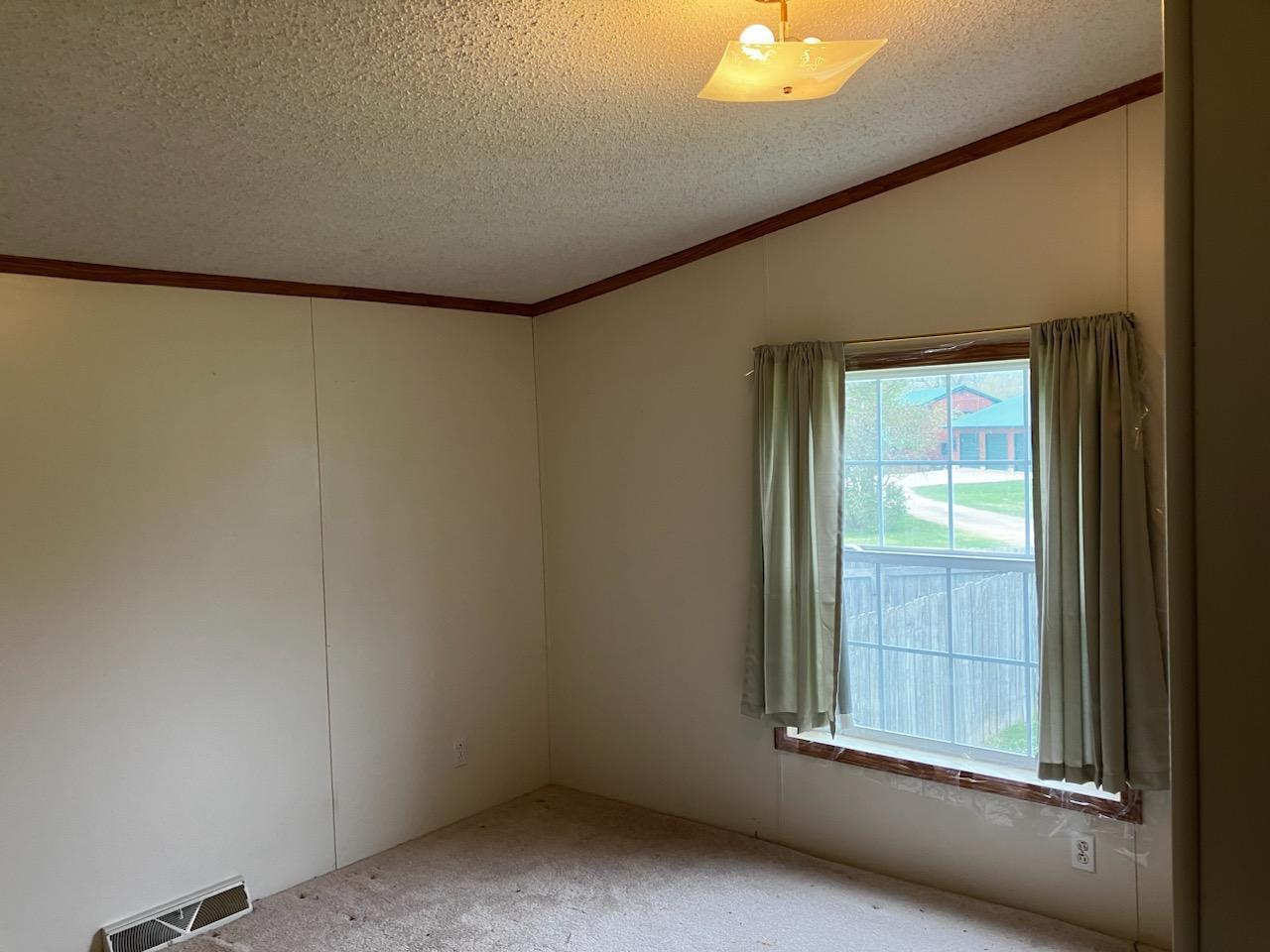 7300 South Rock Nation Road Dixon, IL 61021 - Photo 12 of 24 an empty room with a window
