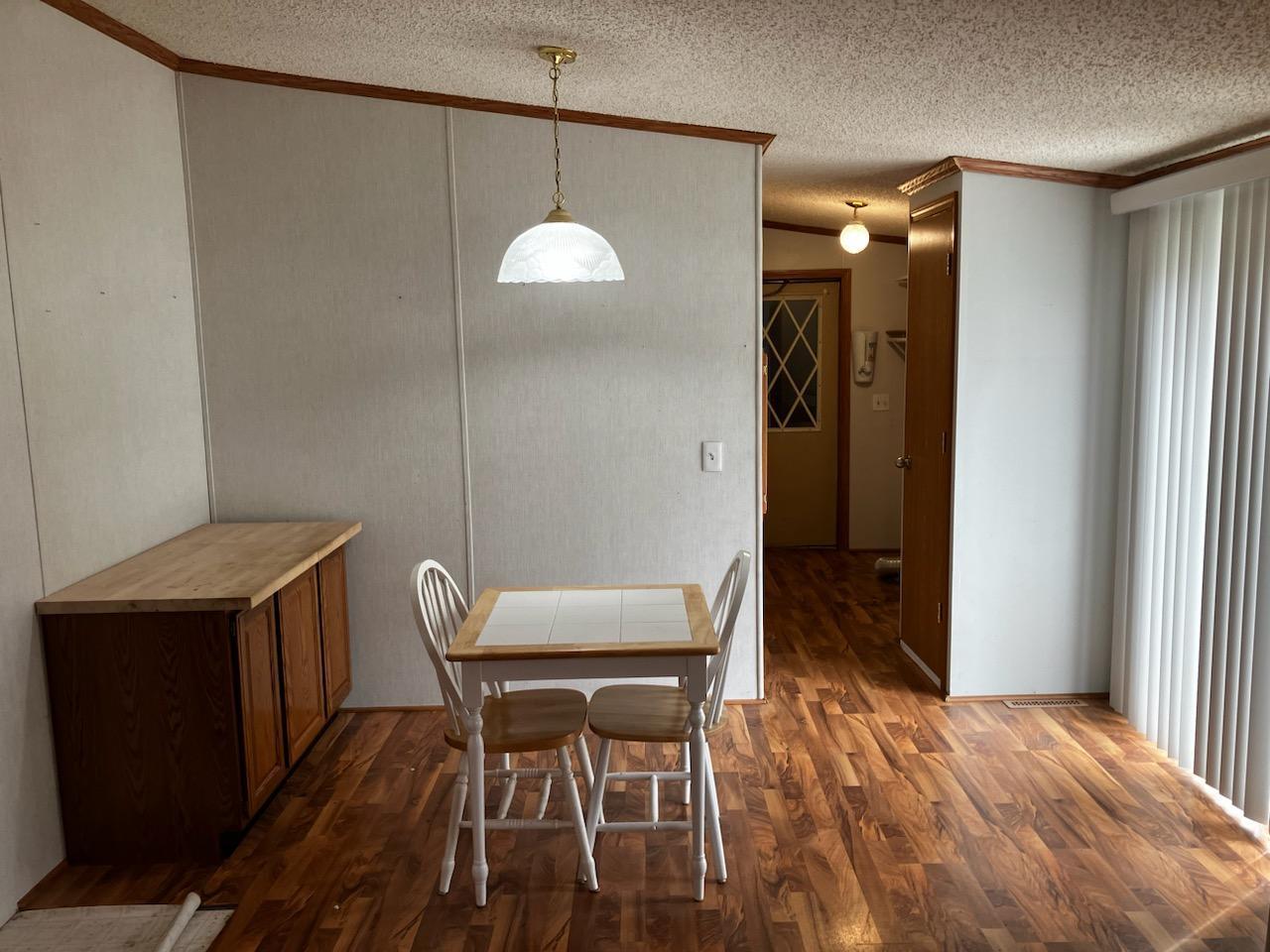 7300 South Rock Nation Road Dixon, IL 61021 - Photo 4 of 24 a view of a room with furniture and wooden floor