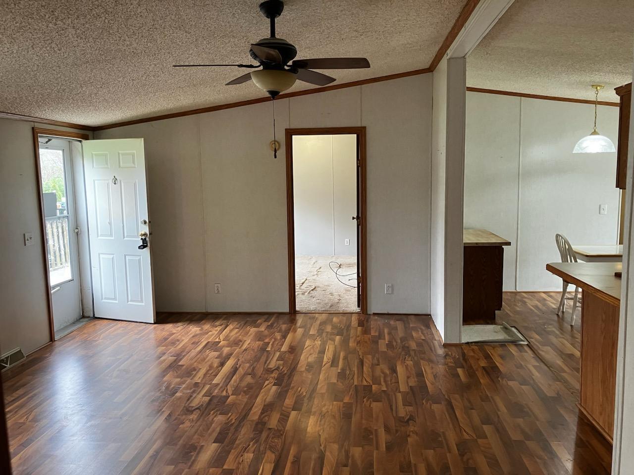 7300 South Rock Nation Road Dixon, IL 61021 - Photo 7 of 24 a view of livingroom with hardwood floor and a ceiling fan
