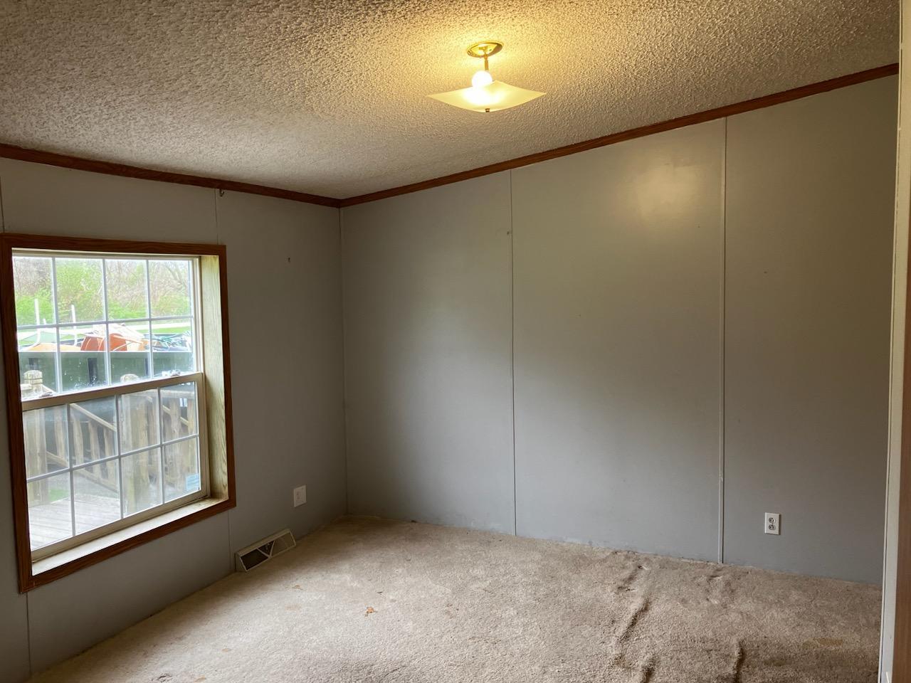 7300 South Rock Nation Road Dixon, IL 61021 - Photo 9 of 24 an empty room with windows and closet