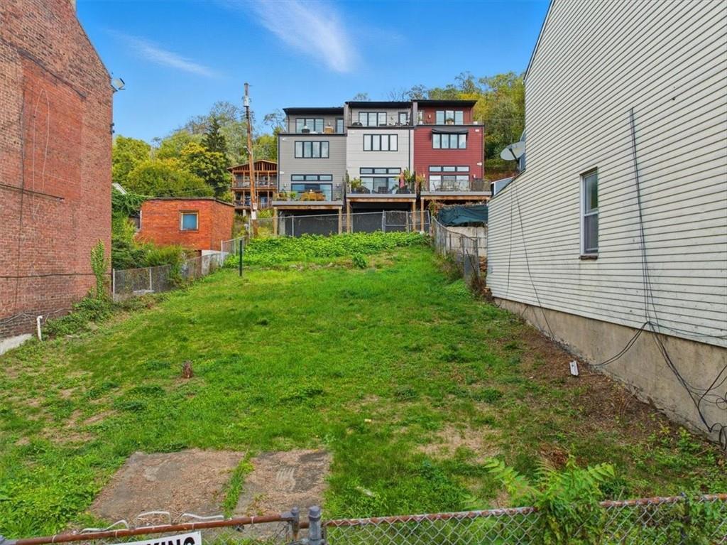 518-520 Armandale Street Pittsburgh, PA 15212 - Photo 8 of 16 a backyard of a house with a garden and outdoor seating