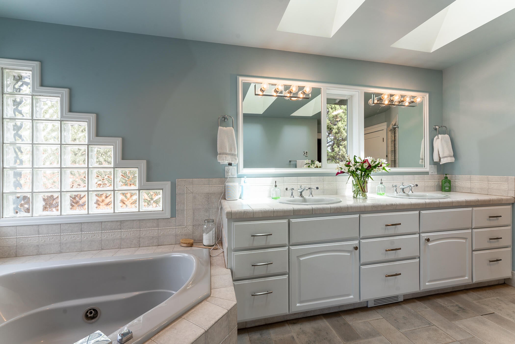 64300 Crosswinds Road Bend, OR 97703 - Photo 32 of 61 Jetted soaking tub and ample cabinet space in the primary bathroom