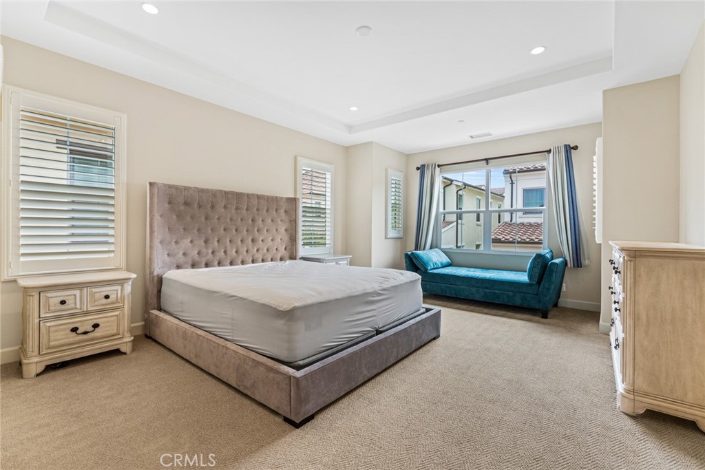 126 Baja Irvine, CA 92620 - Photo 11 of 30 a spacious bedroom with a bed and a window
