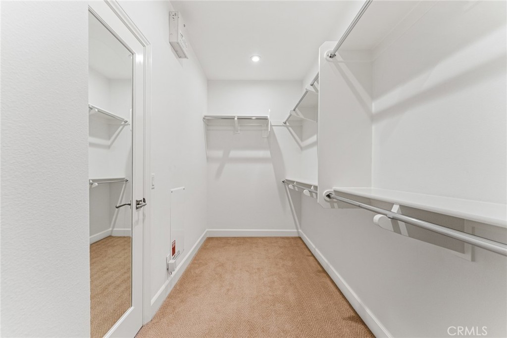 126 Baja Irvine, CA 92620 - Photo 15 of 30 a view of a hallway with white walls and stairs