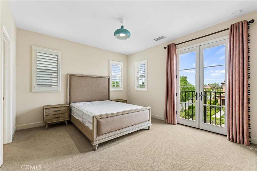126 Baja Irvine, CA 92620 - Photo 19 of 30 a bedroom with a bed and a window