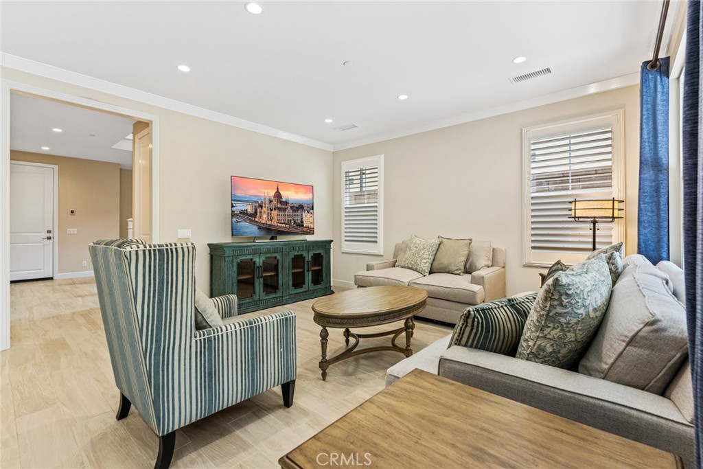 126 Baja Irvine, CA 92620 - Photo 4 of 30 a living room with furniture and a flat screen tv