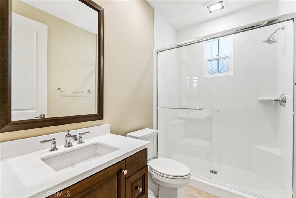 126 Baja Irvine, CA 92620 - Photo 9 of 30 a bathroom with a sink and a mirror