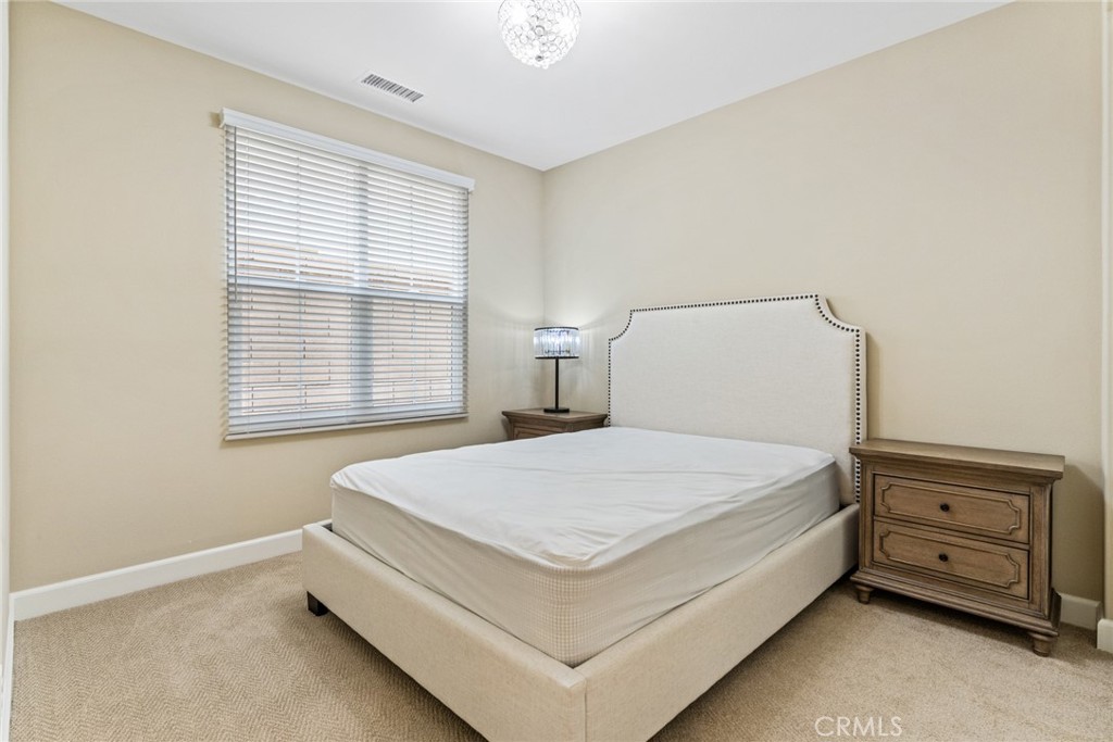 126 Baja Irvine, CA 92620 - Photo 10 of 30 a bedroom with a bed and a window