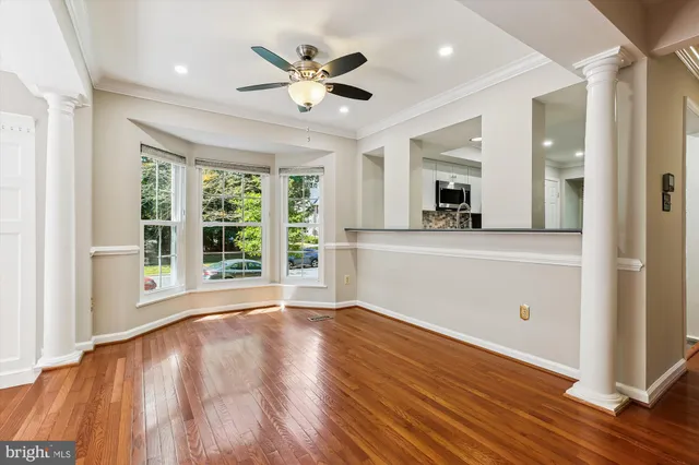 a kitchen with a stove a microwave and refrigerator