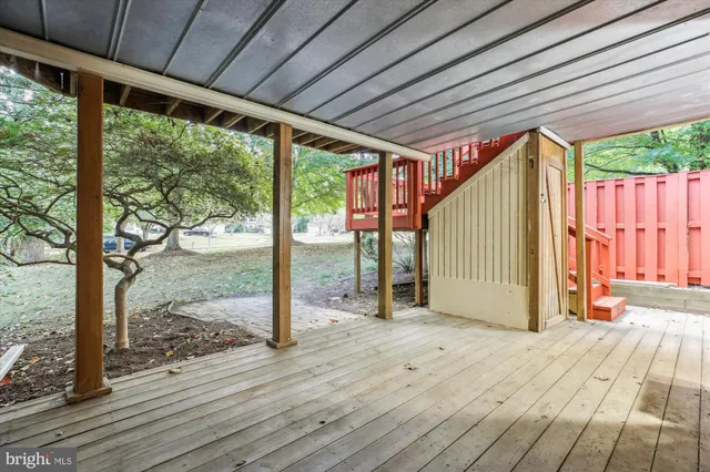 a view of a house with a deck and a garden