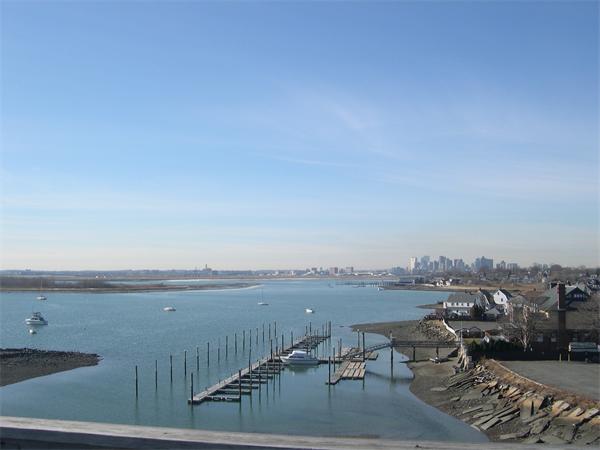 a terrace with outdoor seating and city view