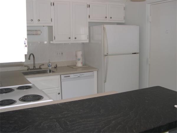 247 Washington, Unit 9 Winthrop, MA 02152 - Photo 4 of 19 a kitchen with a sink dishwasher a stove and a refrigerator