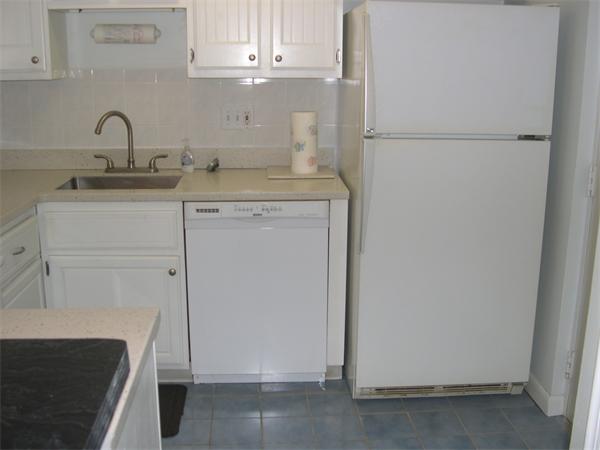 247 Washington, Unit 9 Winthrop, MA 02152 - Photo 7 of 19 a kitchen with a sink and cabinets
