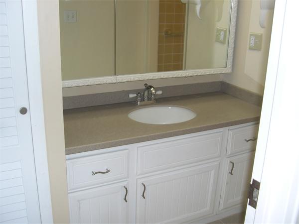 247 Washington, Unit 9 Winthrop, MA 02152 - Photo 9 of 19 a bathroom with a sink and a mirror