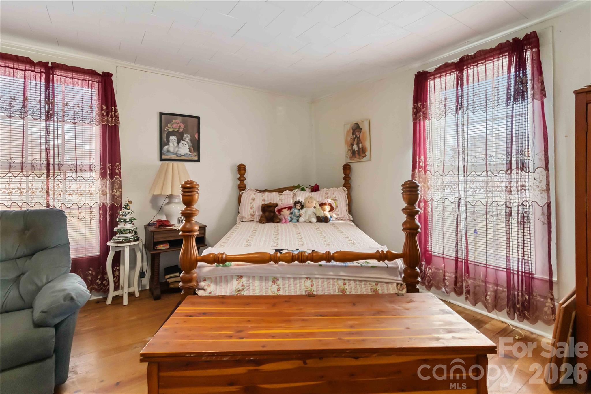 3841 York Street Sharon, SC 29742 - Photo 17 of 31 a bedroom with a bed and wooden floor