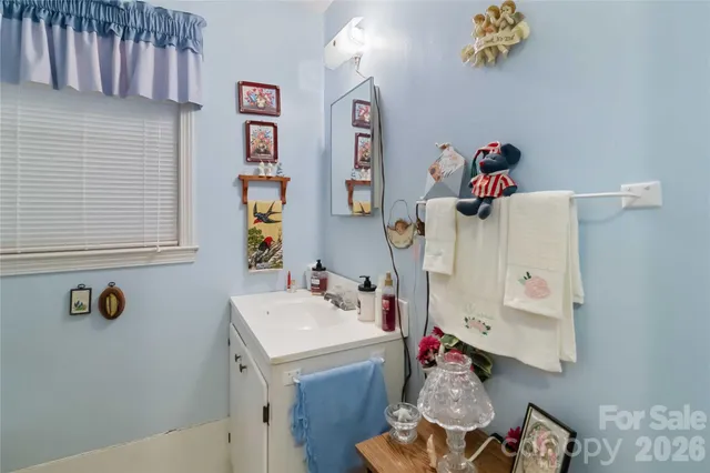 a bathroom with a sink and mirror