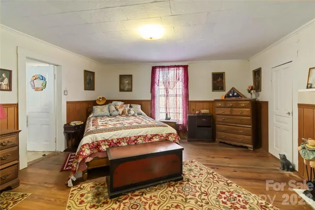 a bedroom with a bed and a closet