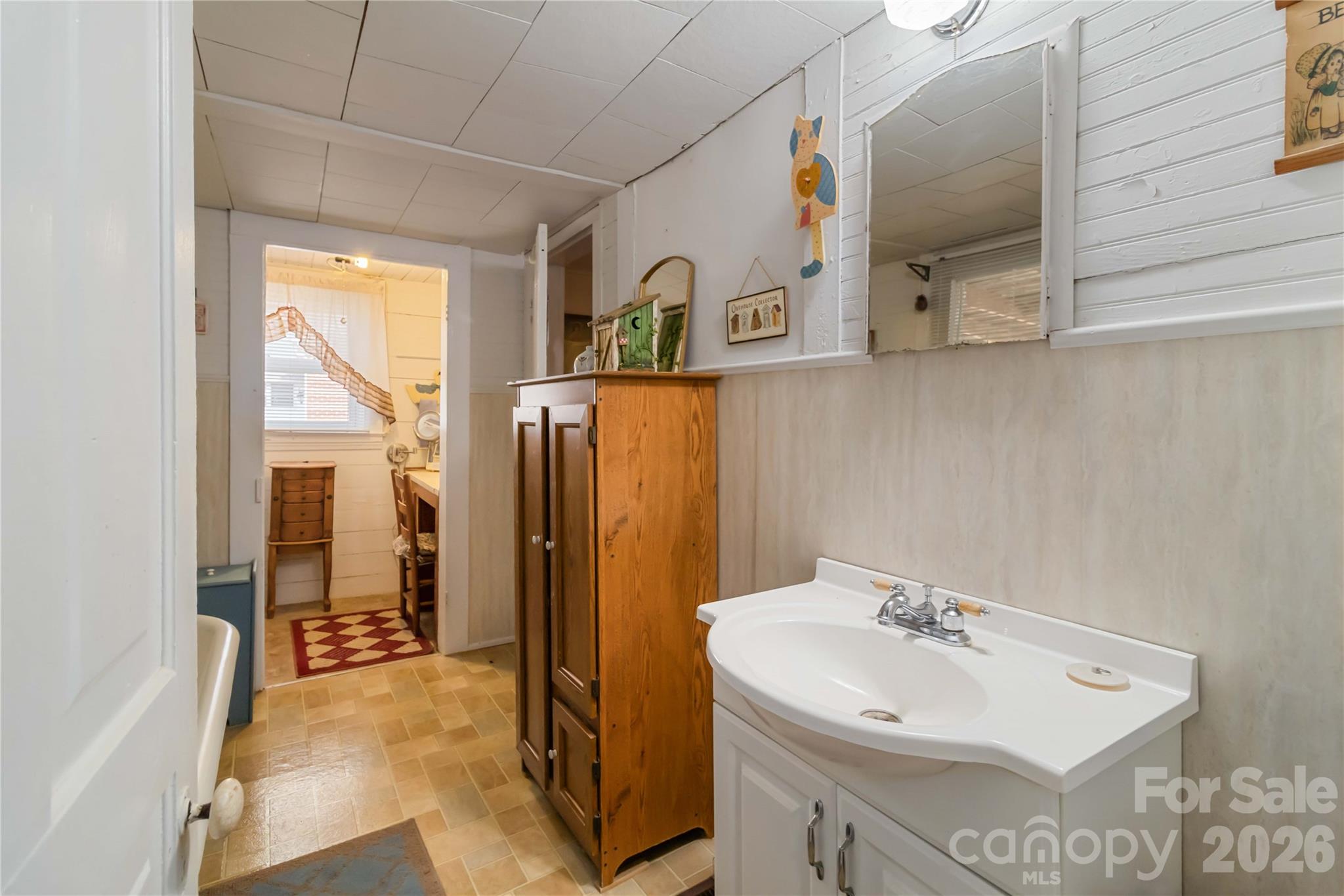 3841 York Street Sharon, SC 29742 - Photo 24 of 31 a bathroom with a sink a mirror and shower